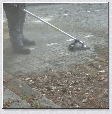 Pavement Grass Trimmer - A heavy-duty, stainless steel tool designed to efficiently tackle tough grass, moss, and brush on hard Kiwi surfaces like concrete and asphalt.