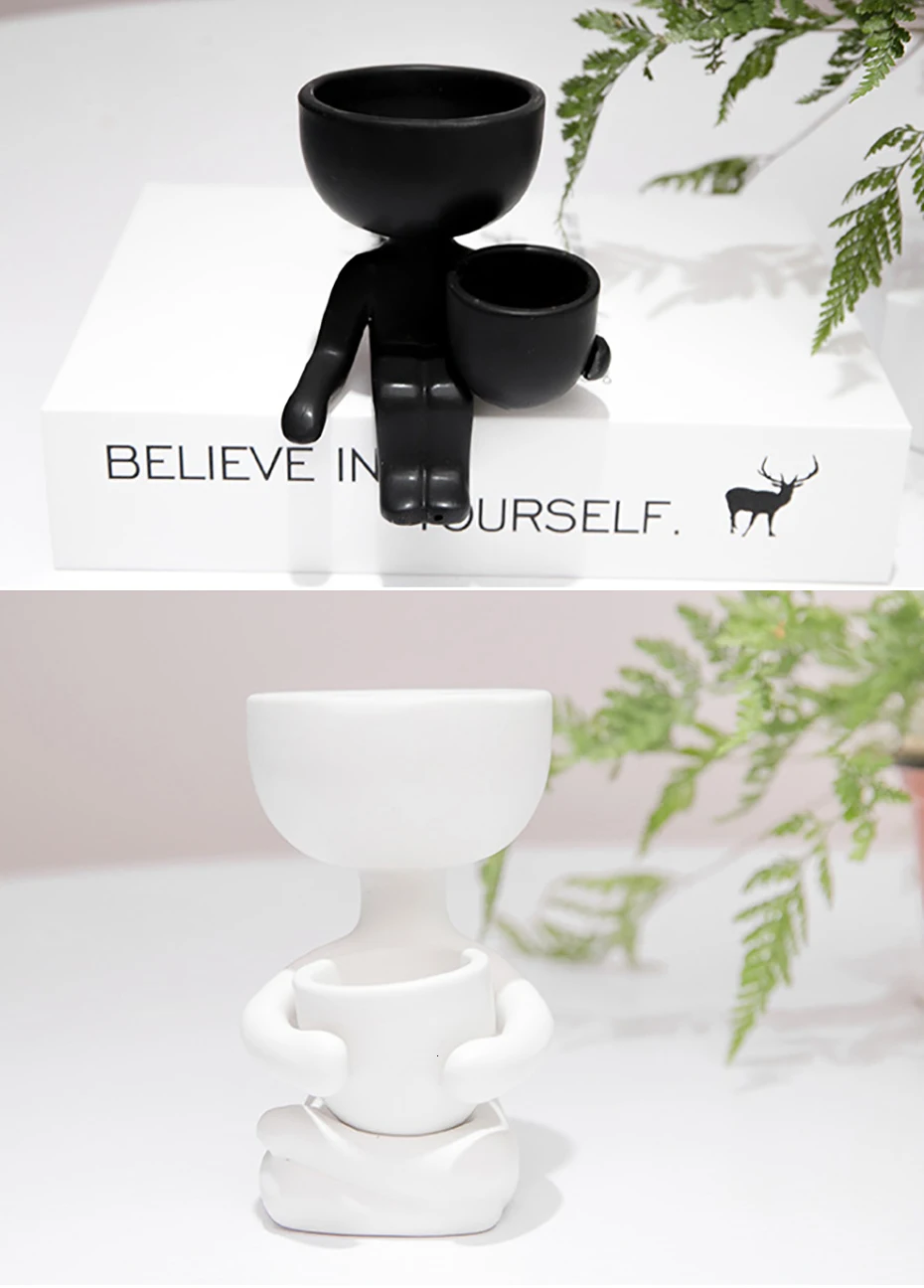 Stylish ceramic planter in black or white, featuring a unique humanoid design perfect for growing indoor plants