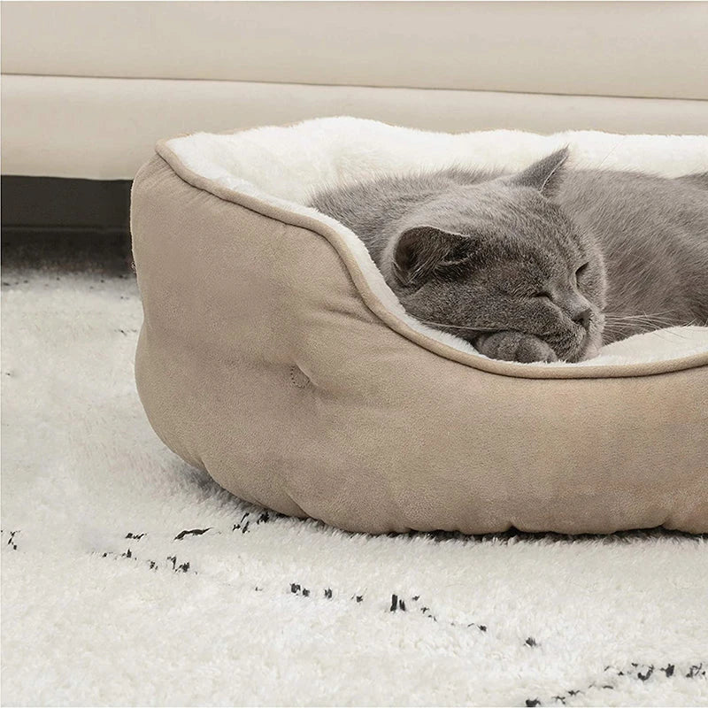 Cozy round small pet bed in beige color with soft microfiber fleece material and non-slip bottom