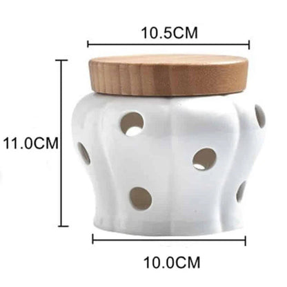 A stylish ceramic and wood garlic storage jar with a sleek, minimalist design, perfect for Kiwi kitchens.