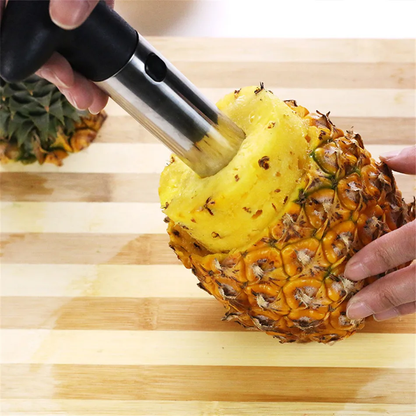 Stainless steel pineapple slicer with ergonomic handle and measurement markings for easy pineapple prep