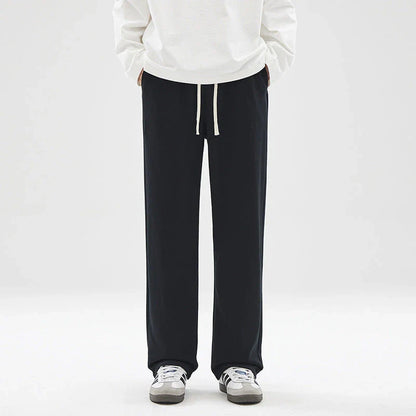 Straight gray sweatpants with a chic draping effect, perfect for Kiwi casual fashion