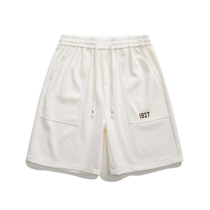 Eco-friendly retro workwear shorts with embroidered design and spacious pockets, perfect for Kiwi lifestyle