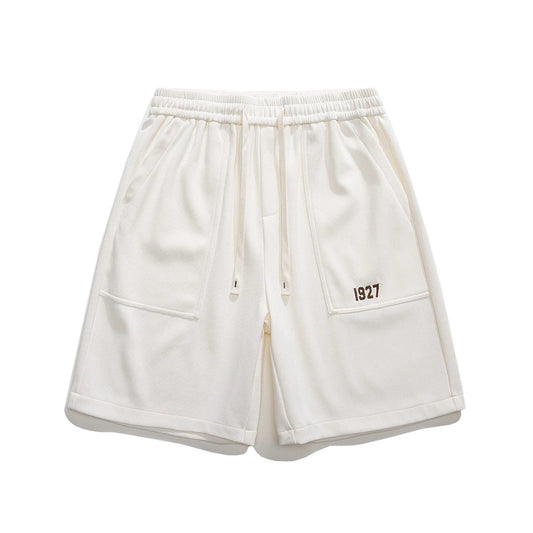 Eco-friendly retro workwear shorts with embroidered design and spacious pockets, perfect for Kiwi lifestyle