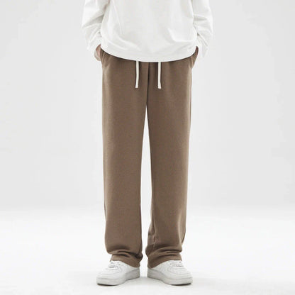 Straight gray sweatpants with a chic draping effect, perfect for Kiwi casual fashion