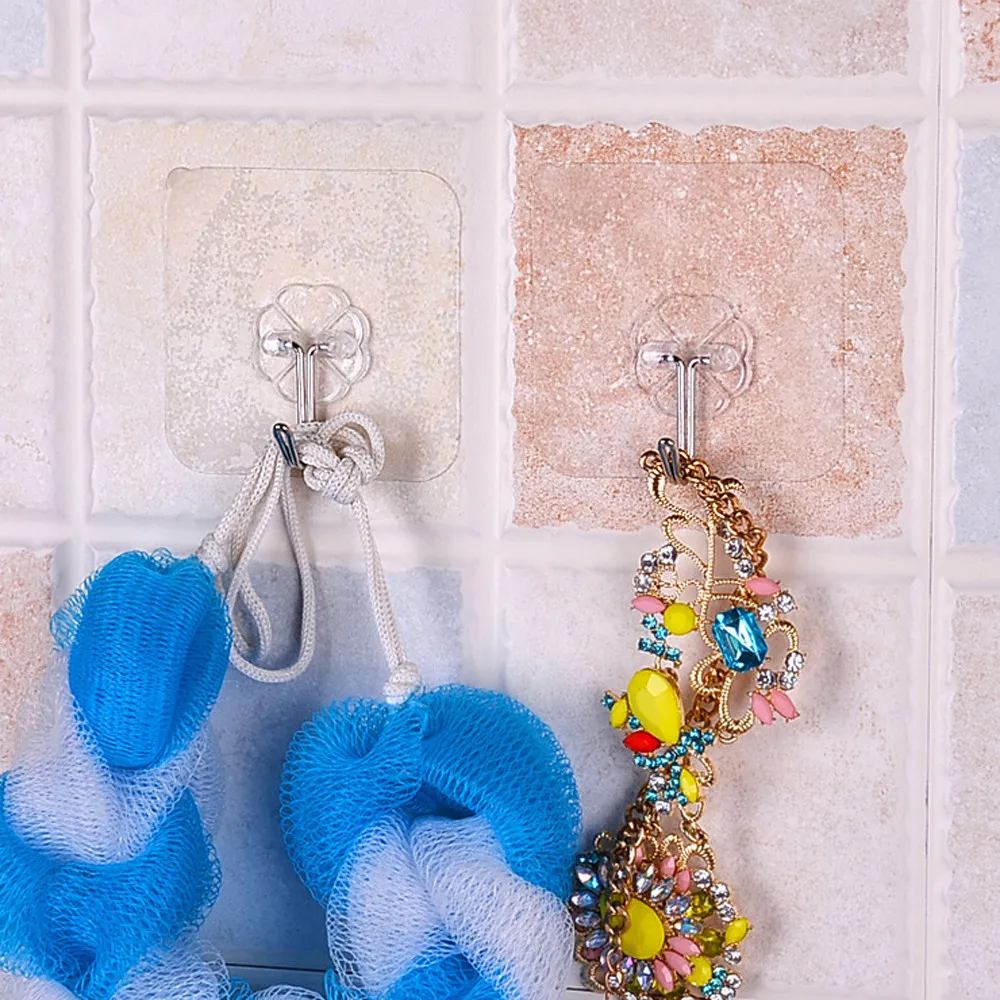 A set of 12 transparent wall hangers that can hold a variety of household items in the bathroom, kitchen, and other rooms