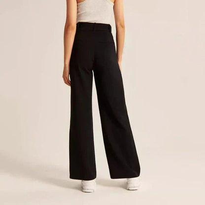 Elegant high-waisted wide-leg trousers in a gray-blue color, perfect for the modern woman's wardrobe.