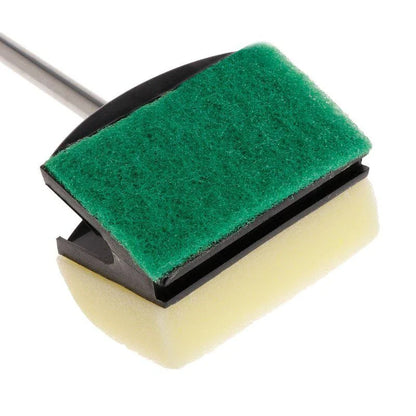 A stainless steel cleaning brush with a double-sided sponge, designed for efficient cleaning on various surfaces in the home.