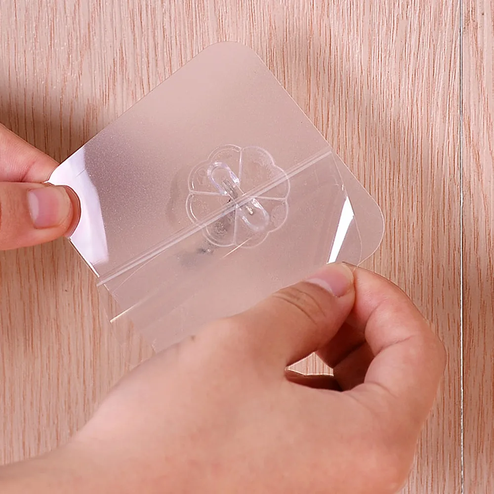 A set of 12 transparent wall hangers that can hold a variety of household items in the bathroom, kitchen, and other rooms