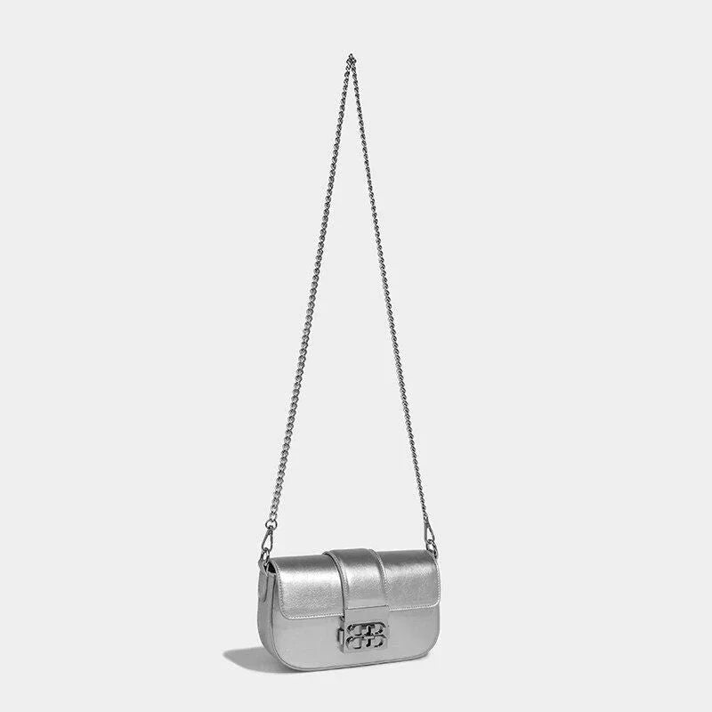 Elegant silver shoulder and crossbody bag for women, featuring a flap design and adjustable straps for versatile use