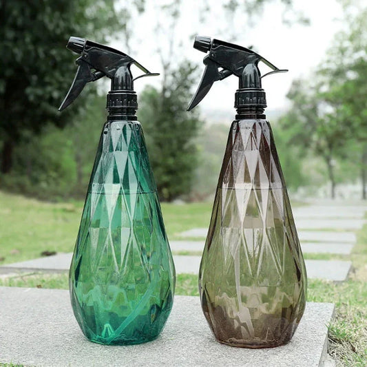 A sleek, 1000ml diamond-patterned watering can with a transparent body for easy water level monitoring