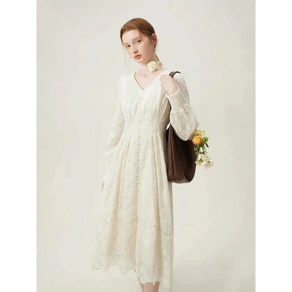 A long-sleeved jacquard dress in beige with a vintage-inspired, romantic design and a comfortable, flattering fit.