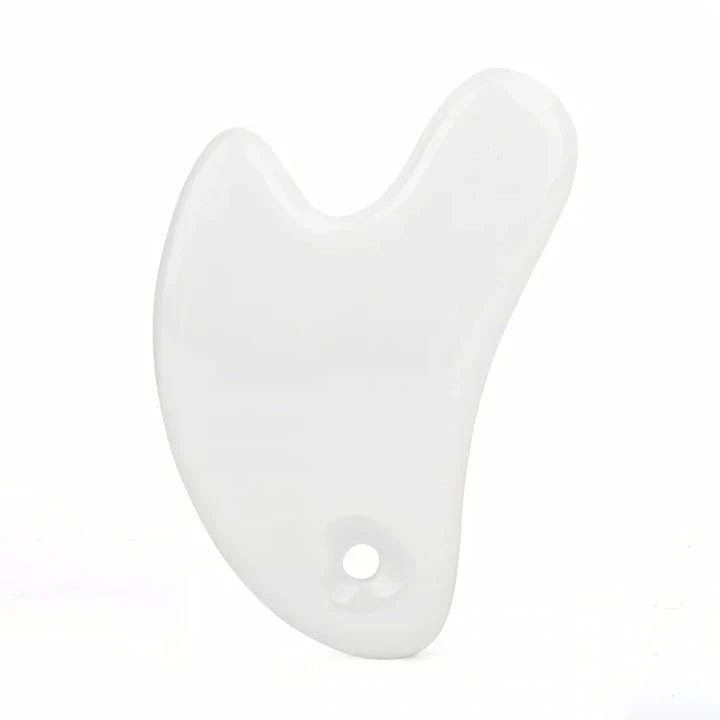 Ceramic Gua Sha Face Massager in various colors - Pink, Blue, and White - for skin rejuvenation and relaxation