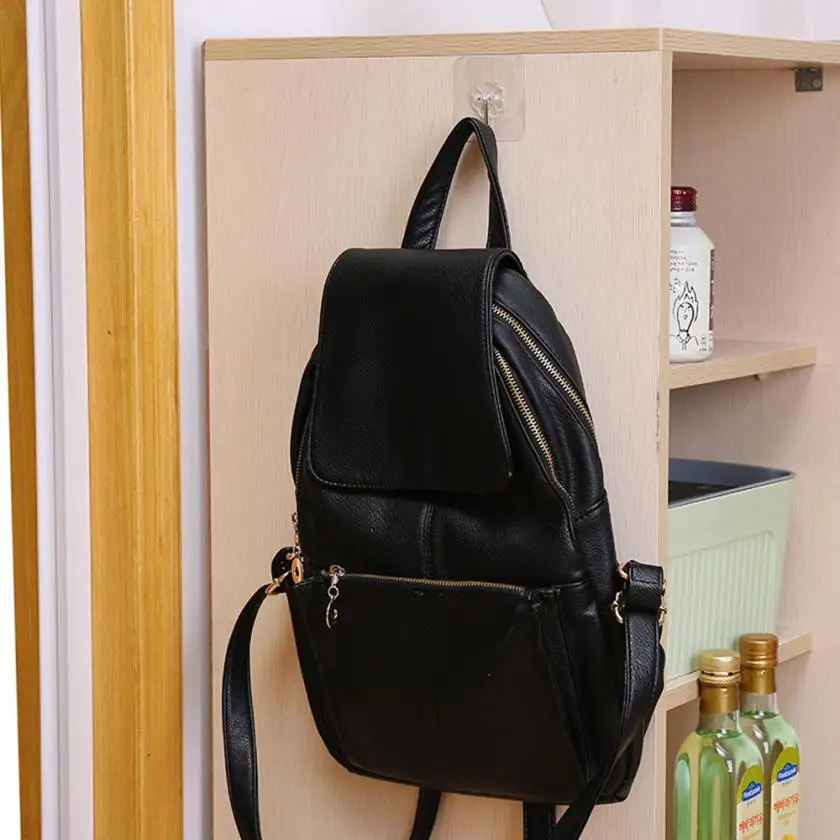 A set of 12 transparent wall hangers that can hold a variety of household items in the bathroom, kitchen, and other rooms