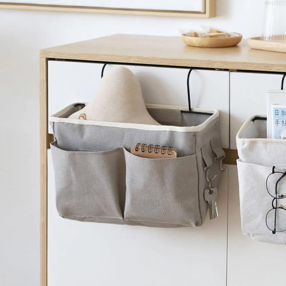 Versatile hanging storage organiser in white and light grey, featuring multiple compartments and hooks for customisable storage in a Kiwi home