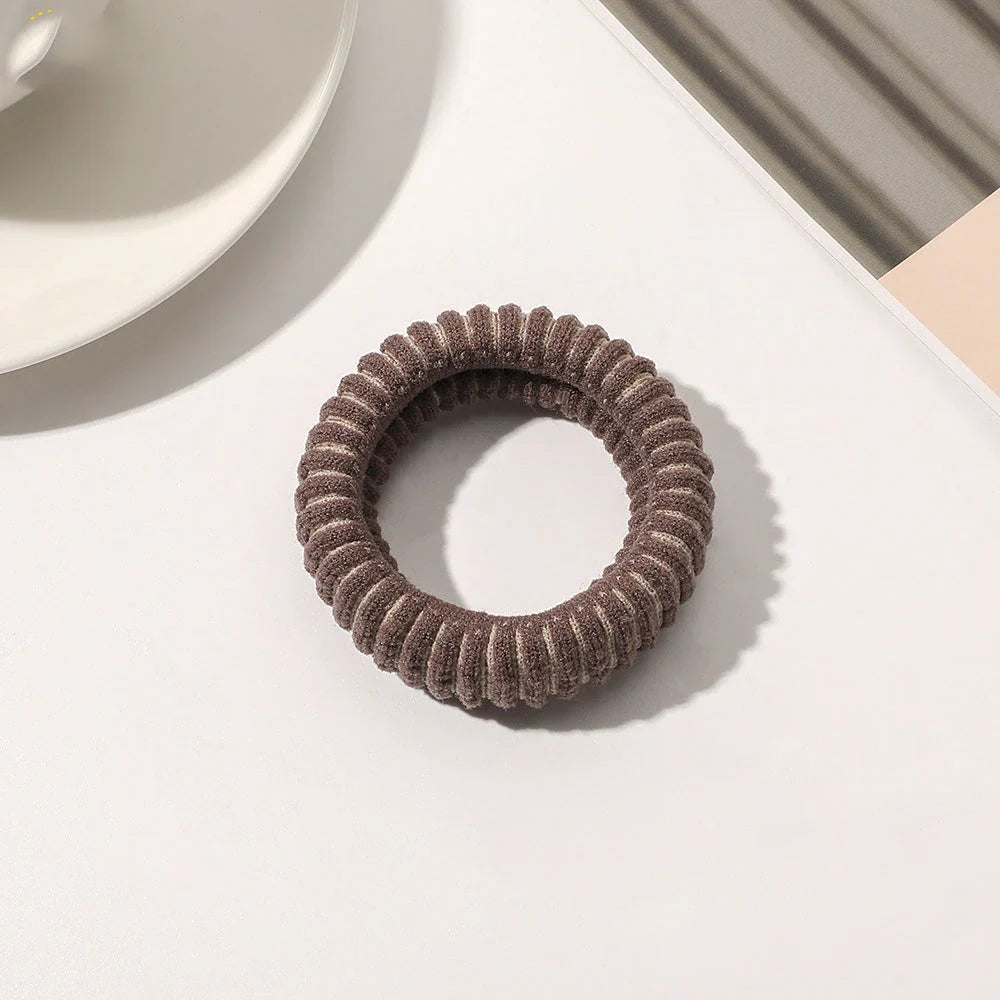 Stylish knitted lattice hair scrunchies in a black and white striped pattern, perfect for Kiwi women's hair accessories