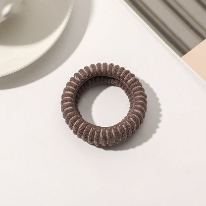 Stylish knitted lattice hair scrunchies in a black and white striped pattern, perfect for Kiwi women's hair accessories