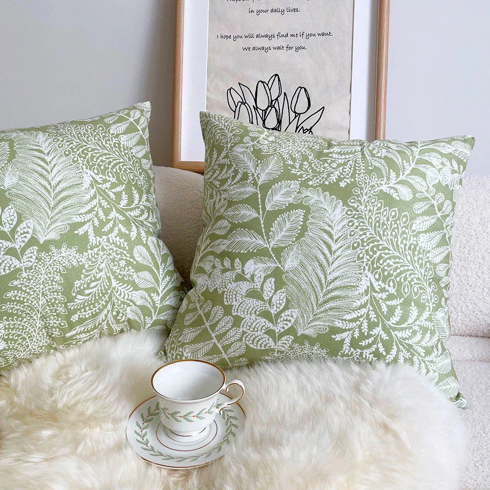 Elegant green floral throw pillow with woven polyester construction, waterproof feature, and multiple size options for Kiwi home decor