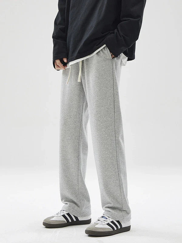 Straight gray sweatpants with a chic draping effect, perfect for Kiwi casual fashion