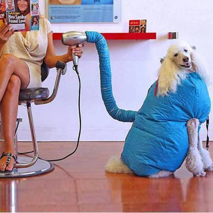 A dog drying bag made of Oxford cloth that uses a hair dryer to quickly and effectively dry a wet dog.