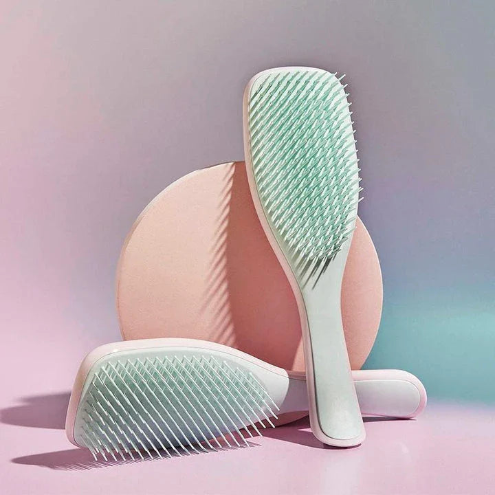 Anti-static hairbrush with soft bristles for detangling and styling hair effortlessly