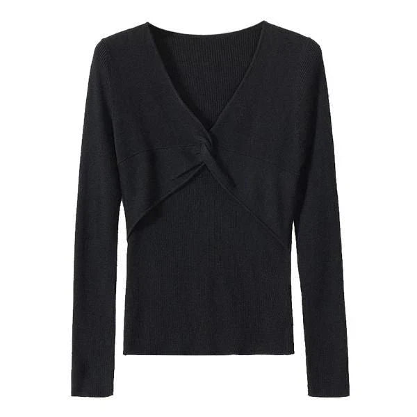 A stylish V-Neck jumper in dark grey, featuring a unique criss-cross design and a flattering slim fit for the modern Kiwi woman.