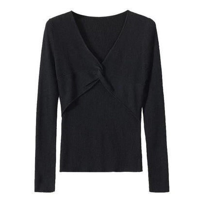 A stylish V-Neck jumper in dark grey, featuring a unique criss-cross design and a flattering slim fit for the modern Kiwi woman.