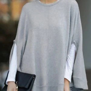 Cosy and relaxed bat-sleeve knit top poncho in a classic plain design, perfect for everyday Kiwi style