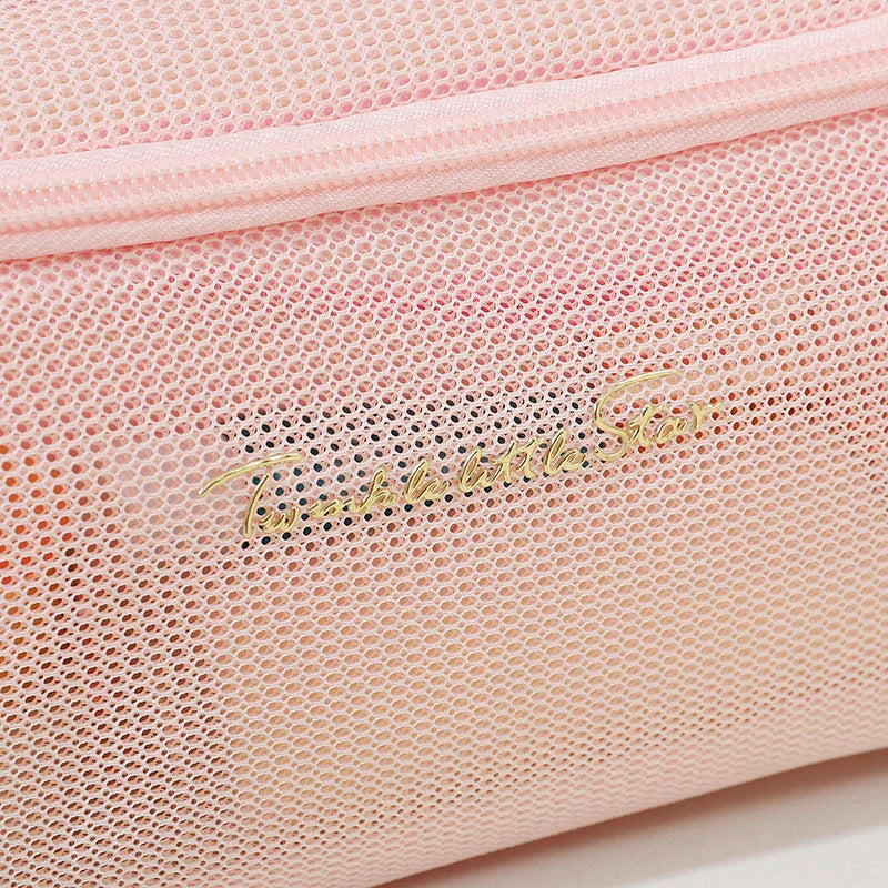 Trendha Clear Mesh Travel Cosmetic Organizer in pink and white colors, with transparent design and zipper closure