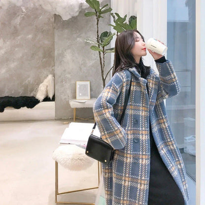 A cosy, plaid jumper coat made from a luxurious blend of mink hair and acrylic for maximum warmth and style.