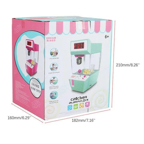 Kiwi-made coin-operated claw machine and alarm clock with precision controls and vibrant LED display