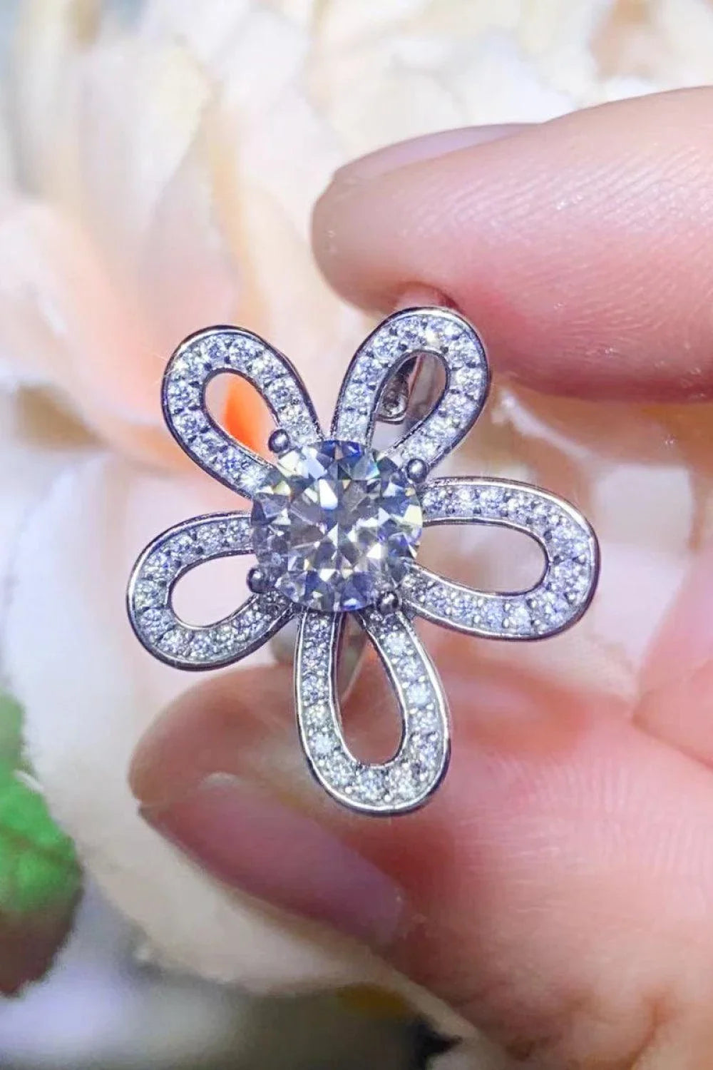 Moissanite flower-shaped open ring with 1 carat center stone and platinum plating