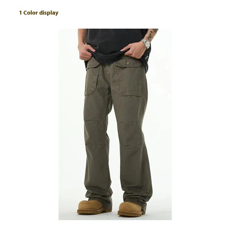 A pair of grey-green cotton overalls with a straight-leg design, perfect for the laid-back Kiwi lifestyle.