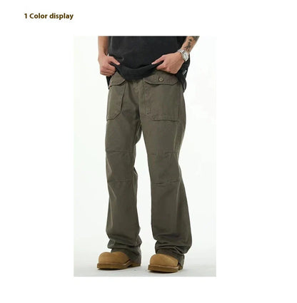 A pair of grey-green cotton overalls with a straight-leg design, perfect for the laid-back Kiwi lifestyle.