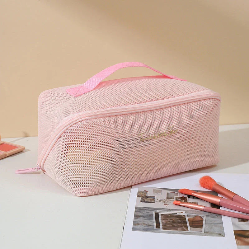 Trendha Clear Mesh Travel Cosmetic Organizer in pink and white colors, with transparent design and zipper closure