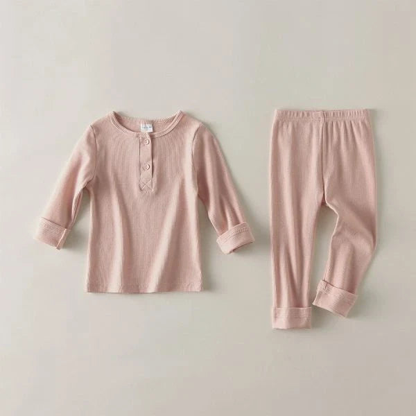 Cosy cotton kids sleepwear sets in various sizes and colours, with soft, breathable fabric and flexible fit for comfortable, restful sleep.