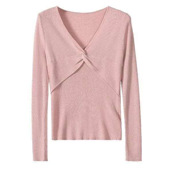 A stylish V-Neck jumper in dark grey, featuring a unique criss-cross design and a flattering slim fit for the modern Kiwi woman.