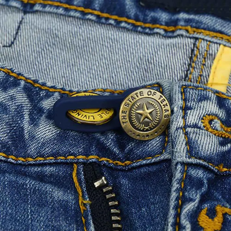 Adjustable metal buttons in various colors for customizing the fit of jeans and pants