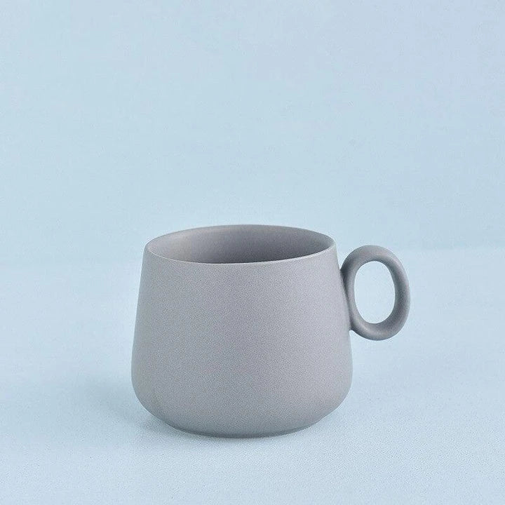 Pastel green ceramic coffee mug with a Kiwiana-inspired design, perfect for daily use in New Zealand homes and cafes.