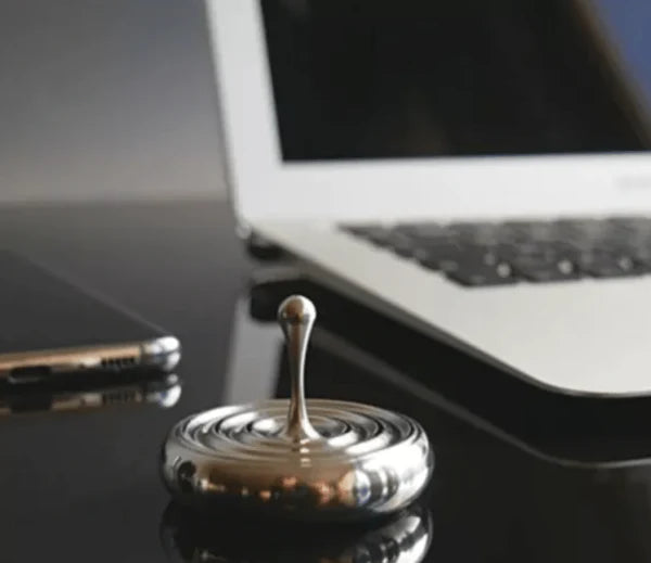 Elegant rotating gyroscope desk accessory with a mesmerizing, long-lasting spin