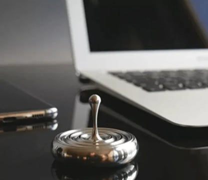 Elegant rotating gyroscope desk accessory with a mesmerizing, long-lasting spin