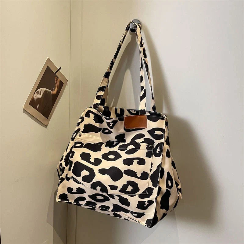 Oversized leopard print canvas shoulder bag with ample storage and stylish design, perfect for Kiwi women
