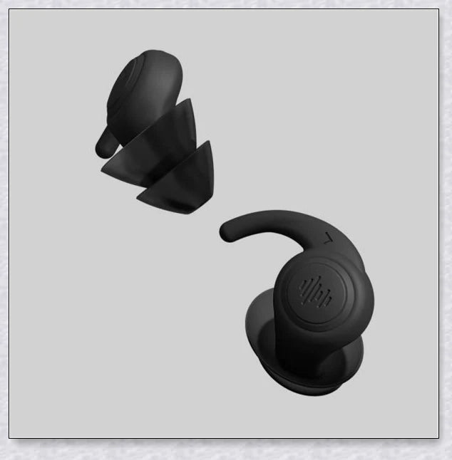 Pair of silicone ear plugs in black and white colors, designed for comfortable and effective noise reduction during sleep