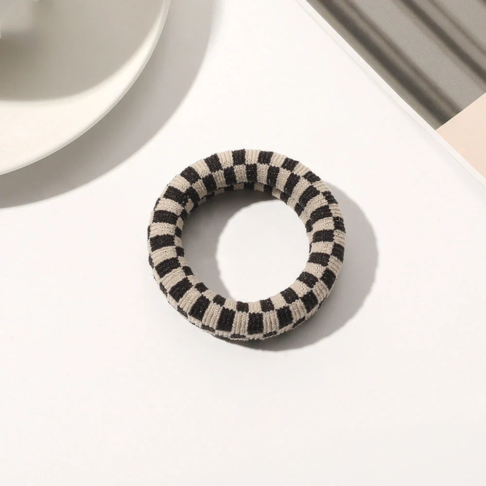 Stylish knitted lattice hair scrunchies in a black and white striped pattern, perfect for Kiwi women's hair accessories