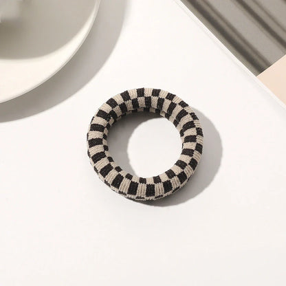 Stylish knitted lattice hair scrunchies in a black and white striped pattern, perfect for Kiwi women's hair accessories